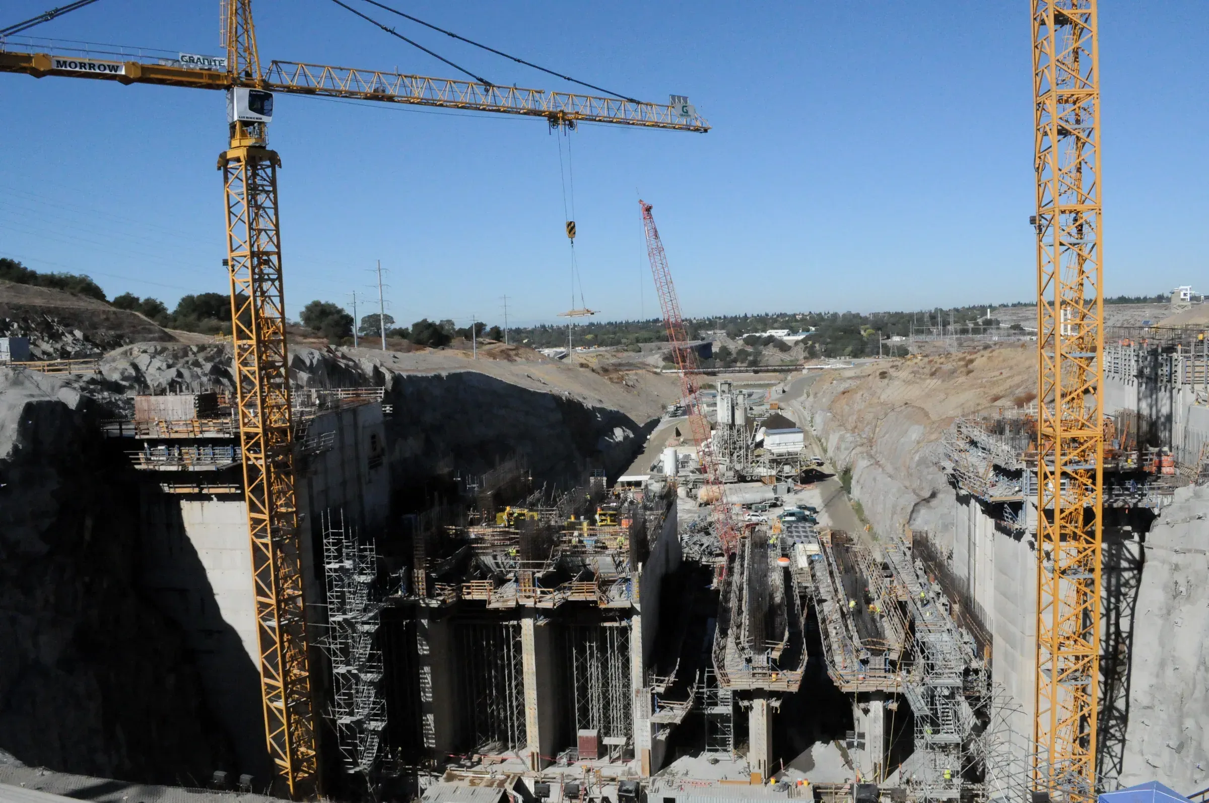 Folsom Dam auxiliary spillway and Folsom Lake Crossing from the air, California
