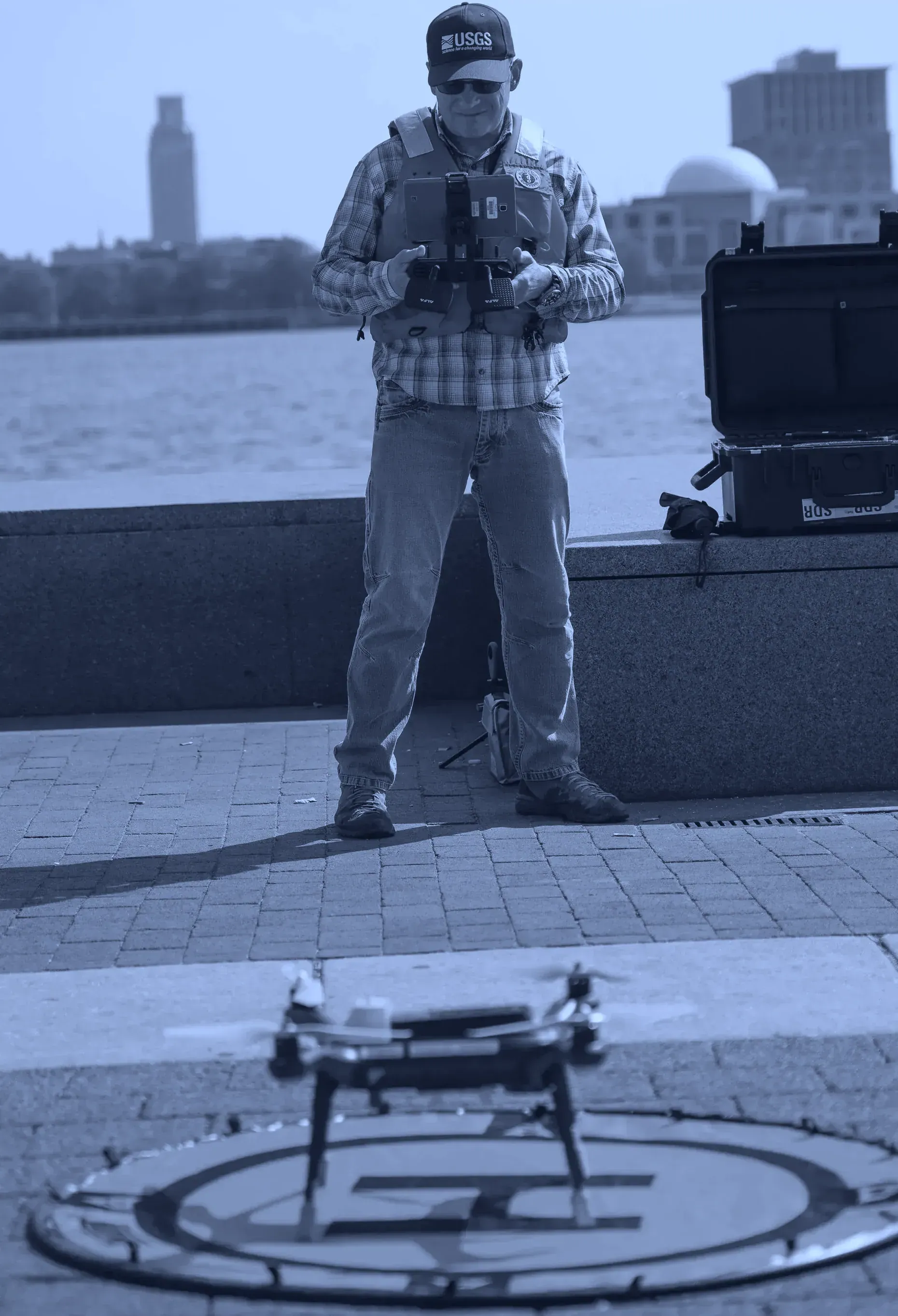 USGS hydrographer flying a Q-Cam survey aircraft to measure stream velocity